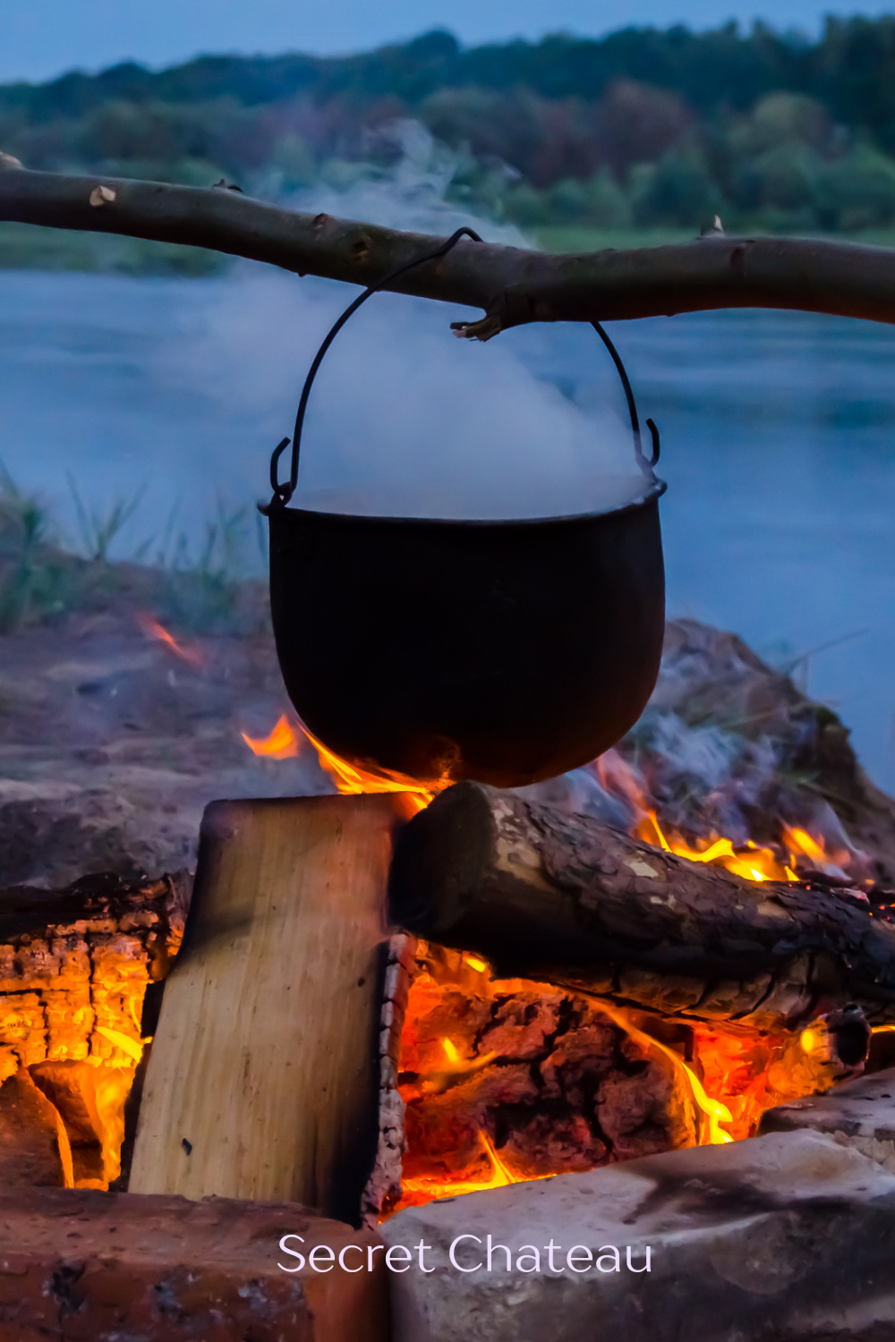 Old cauldron above an open fire.