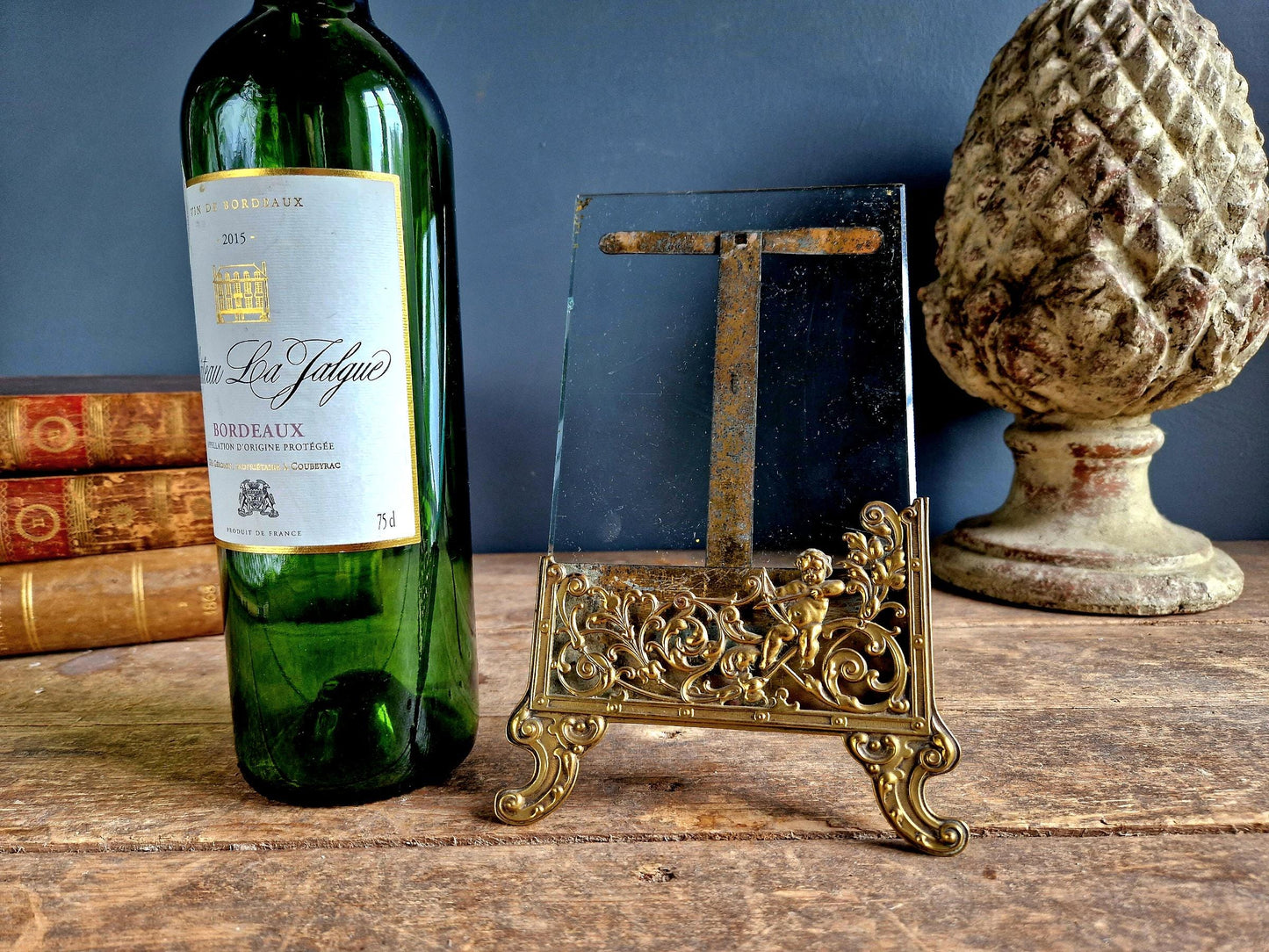 French antique glass photo frame with gilt scrolling metal base.