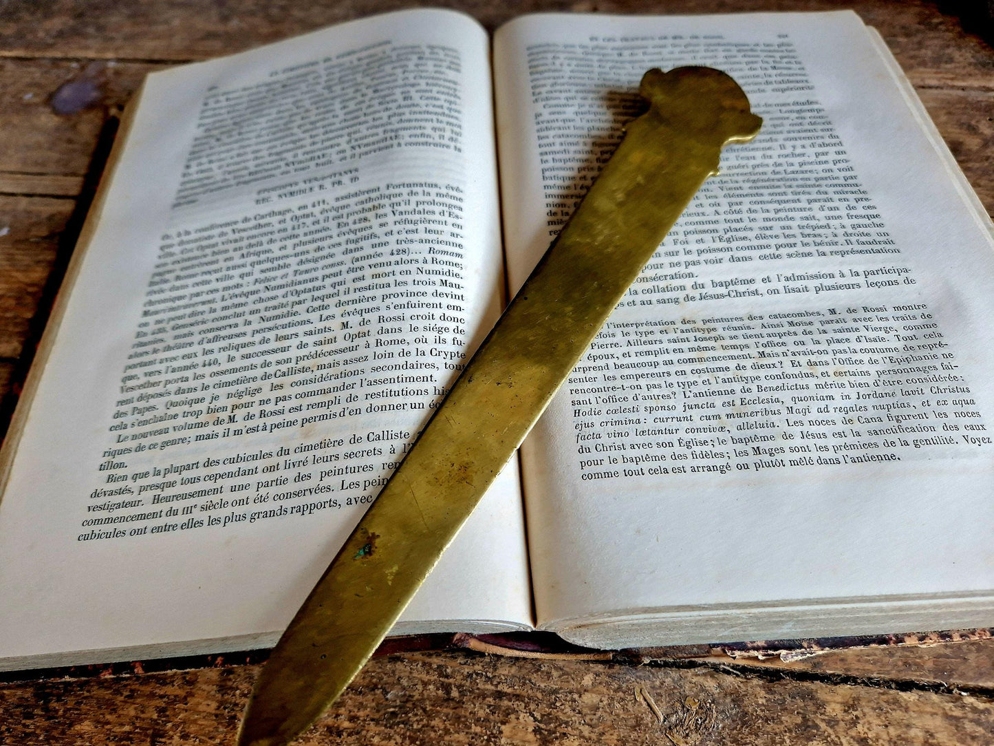 French bronze Art Nouveau paper knife with ladies head decoration.
