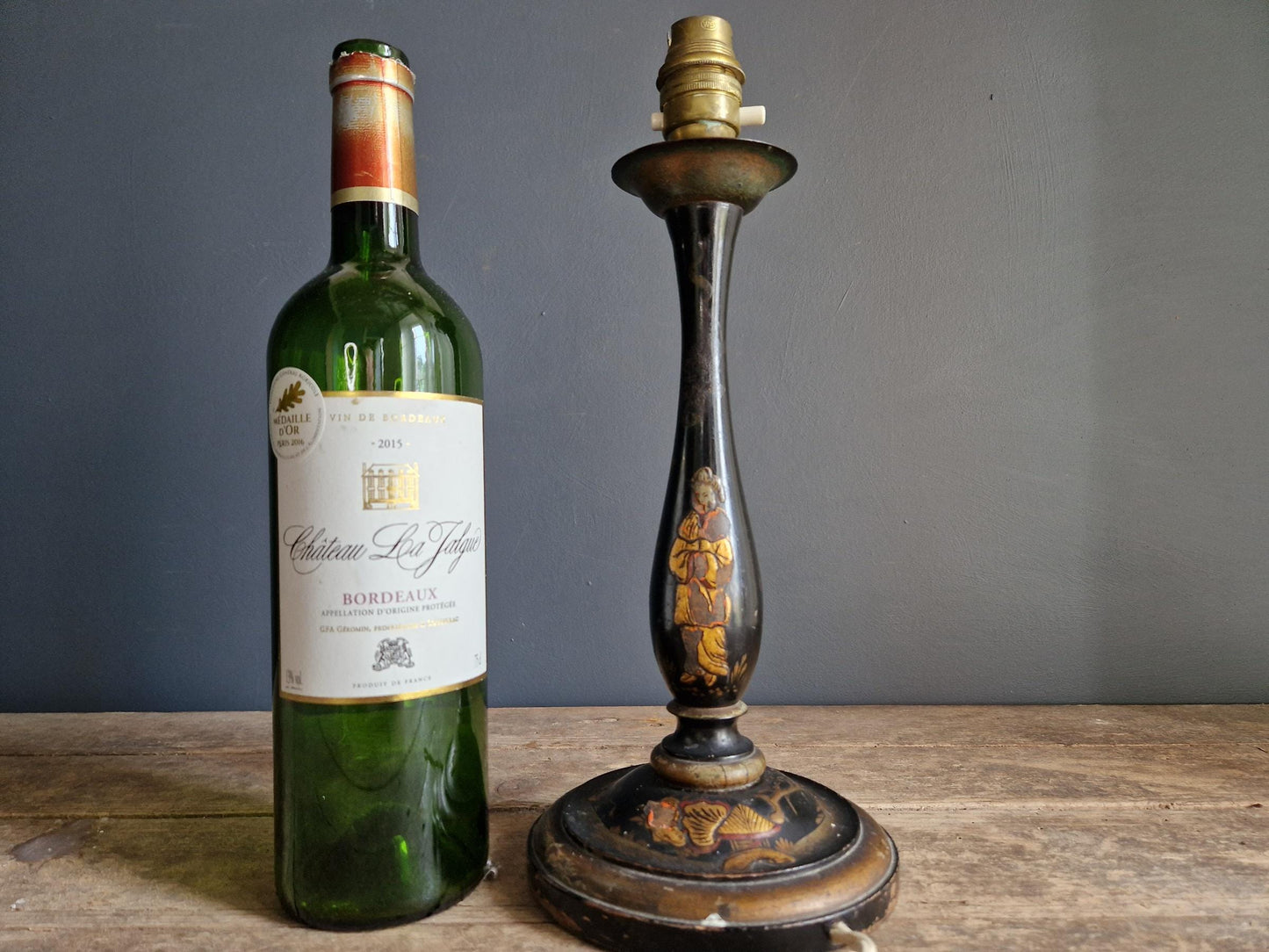 Antique Chinoiserie black table lamp with gilt highlight decoration.