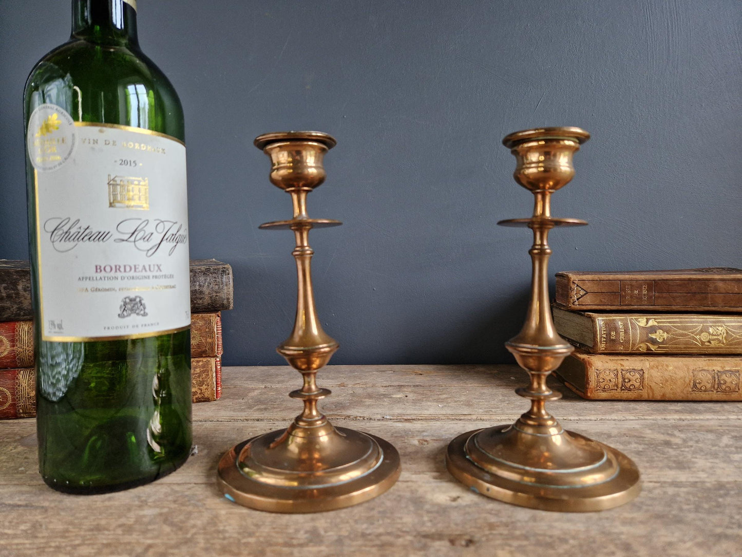 French antique candlesticks. Antique brass candle holders with wax drip plate beneath.