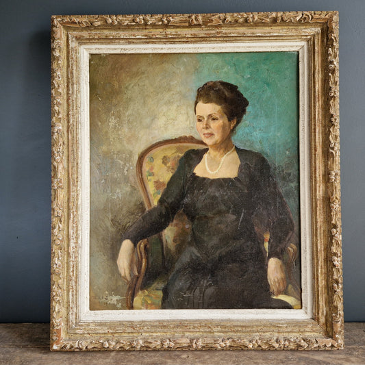 Antique portrait of a seated lady.