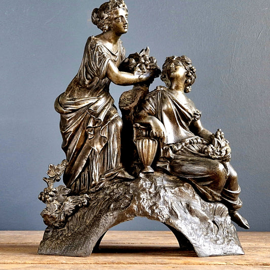 French spelter statue showing two ladies in a classical scene.