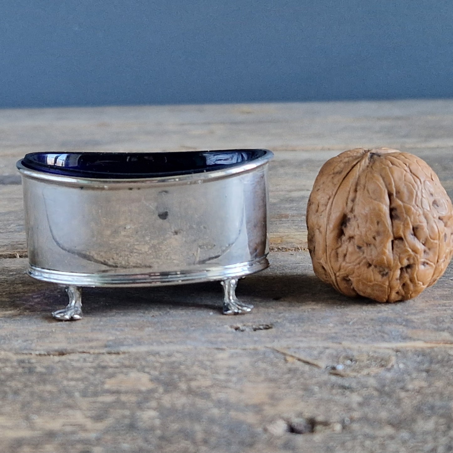 English silver salt pot. Silver antique English blue lined salt dating to 1912.