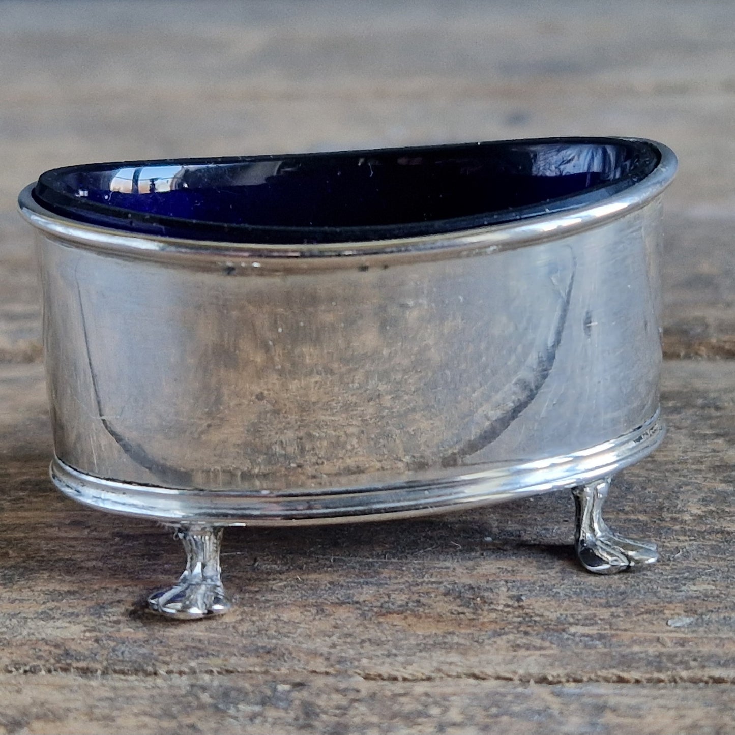 English silver salt pot. Silver antique English blue lined salt dating to 1912.