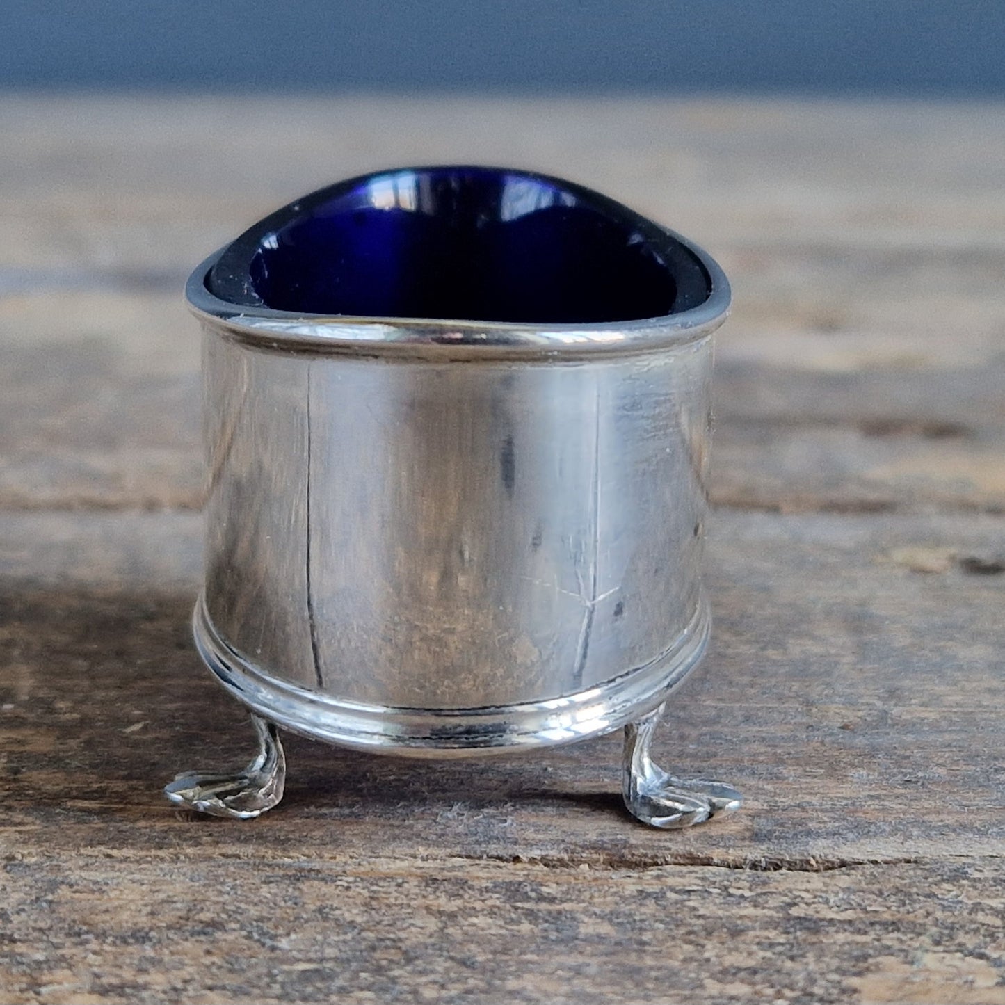 English silver salt pot. Silver antique English blue lined salt dating to 1912.