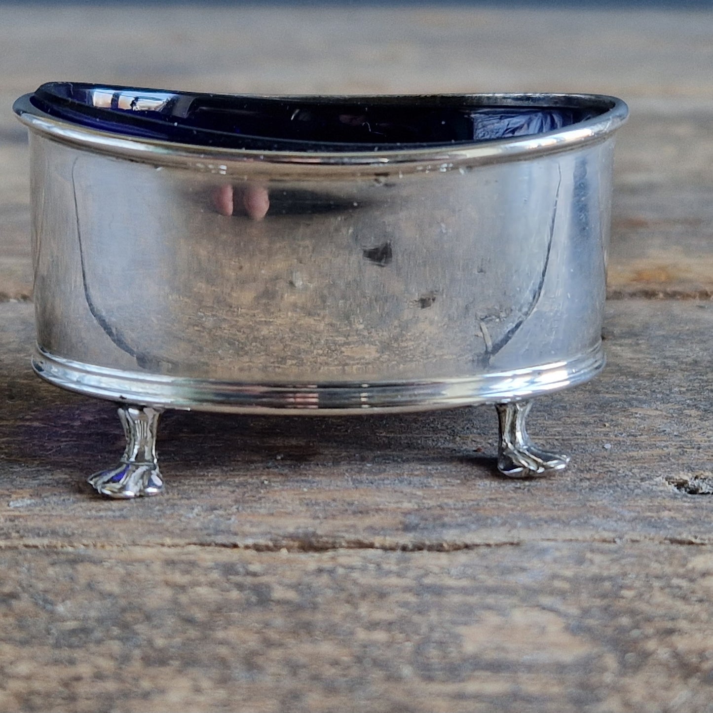 English silver salt pot. Silver antique English blue lined salt dating to 1912.