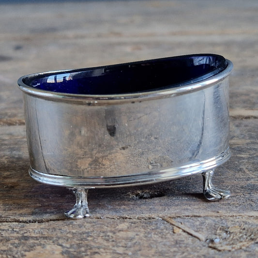 English silver salt pot. Silver antique English blue lined salt dating to 1912.