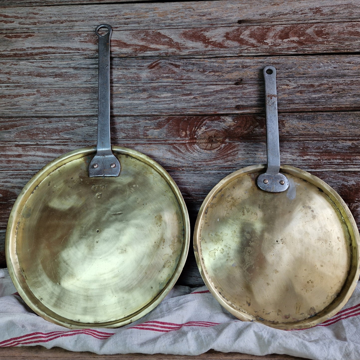 French antique brass pan lids. French kitchen decor.