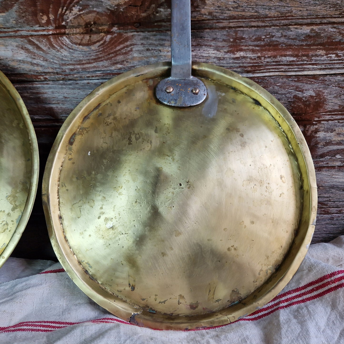 French antique brass pan lids. French kitchen decor.