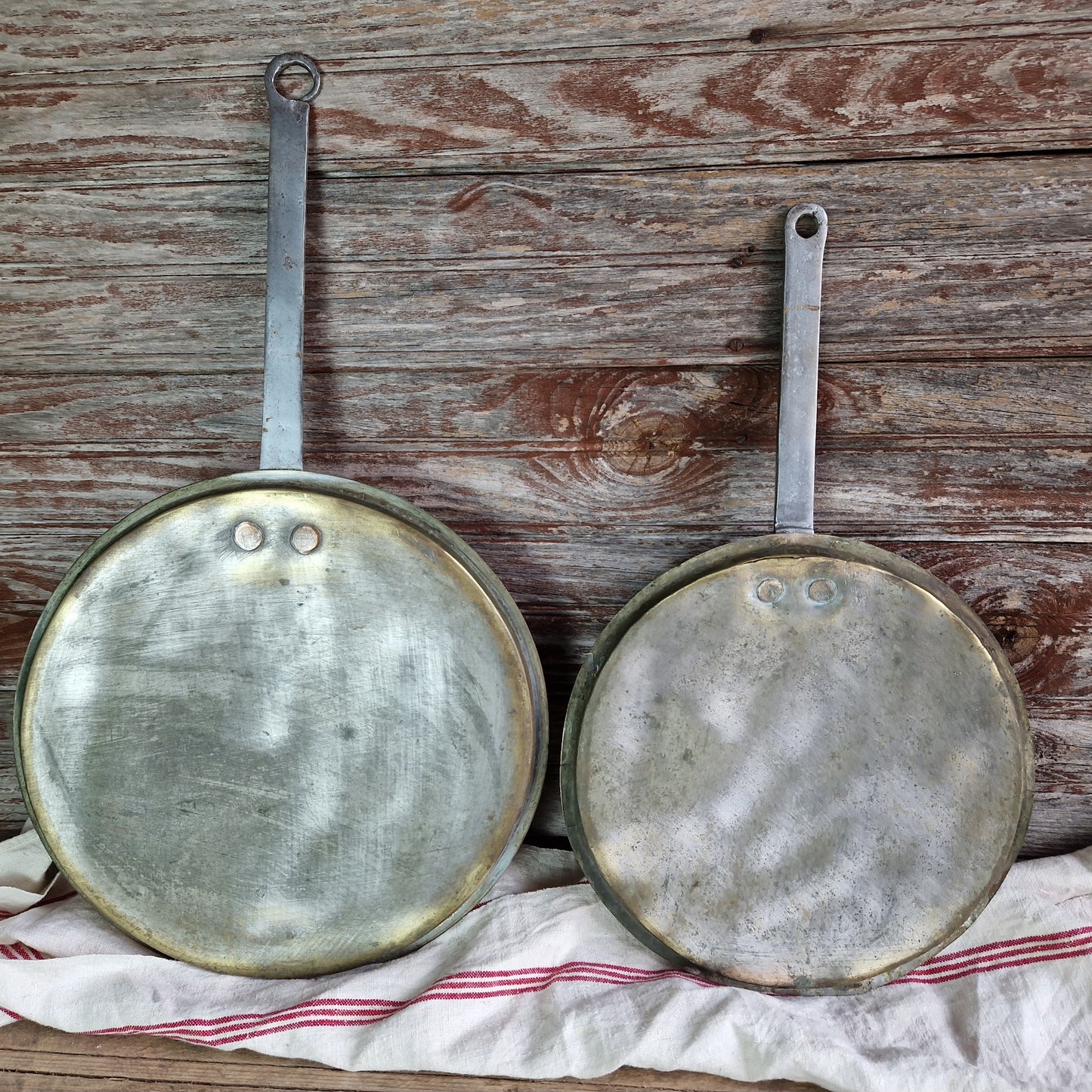 French antique brass pan lids. French kitchen decor.
