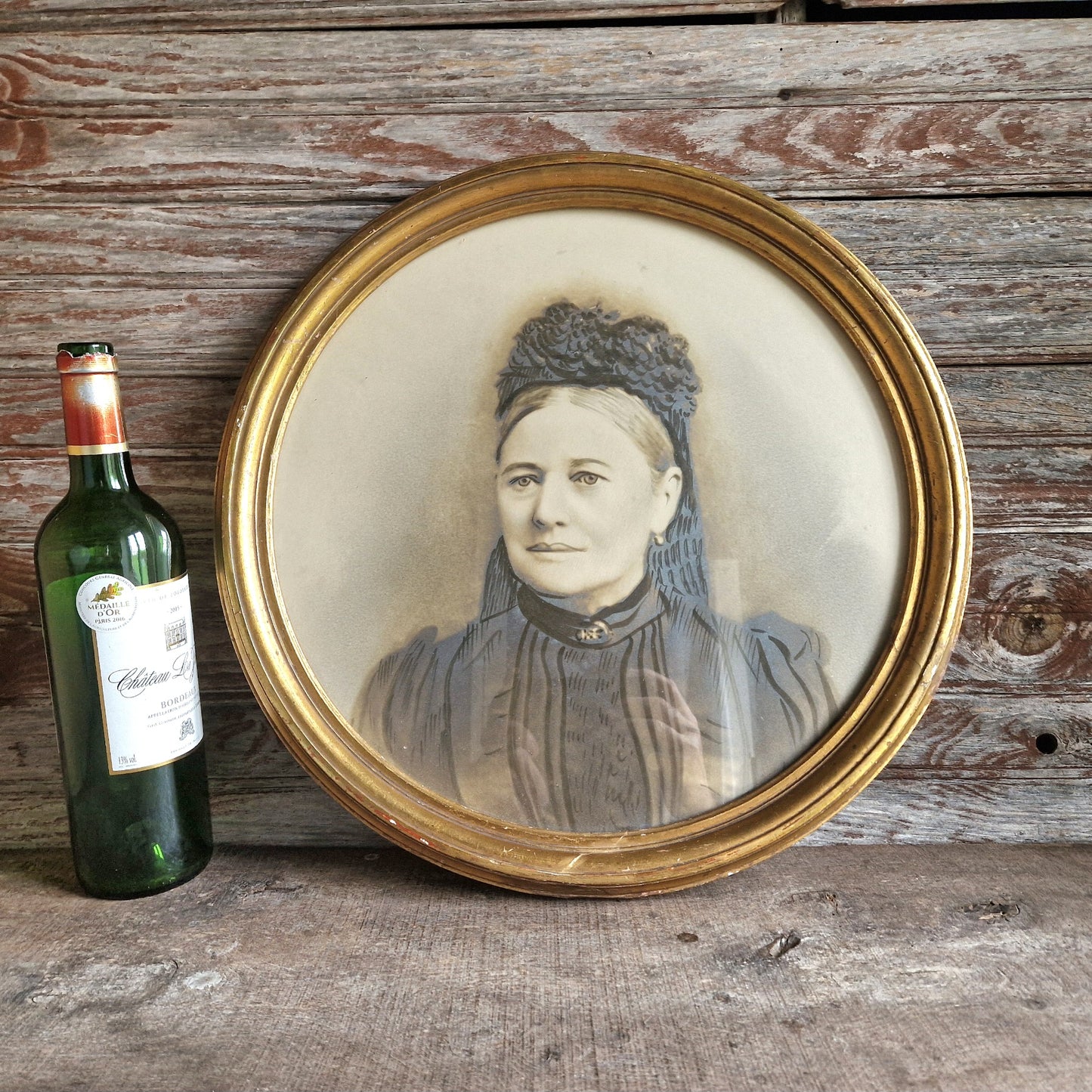 French antique overpainted photo portrait of a lady in a gilt gesso round frame.