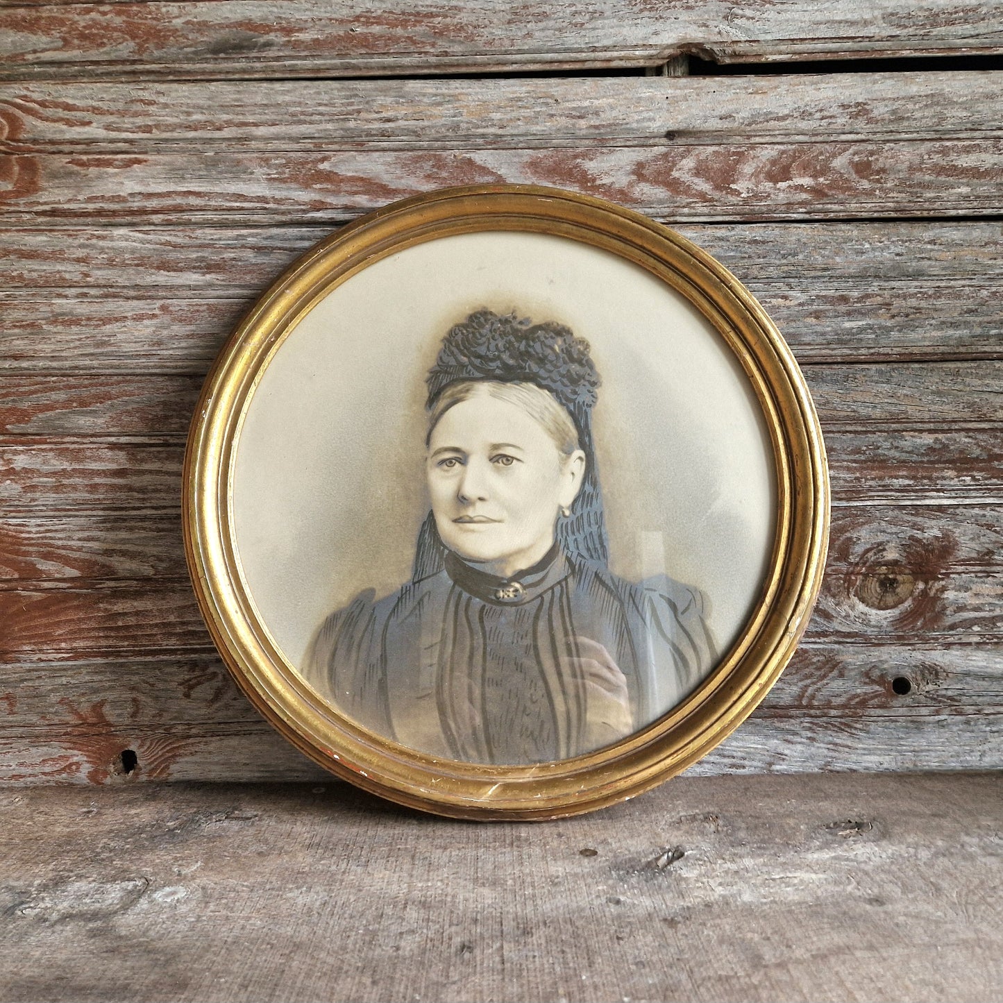 French antique overpainted photo portrait of a lady in a gilt gesso round frame.