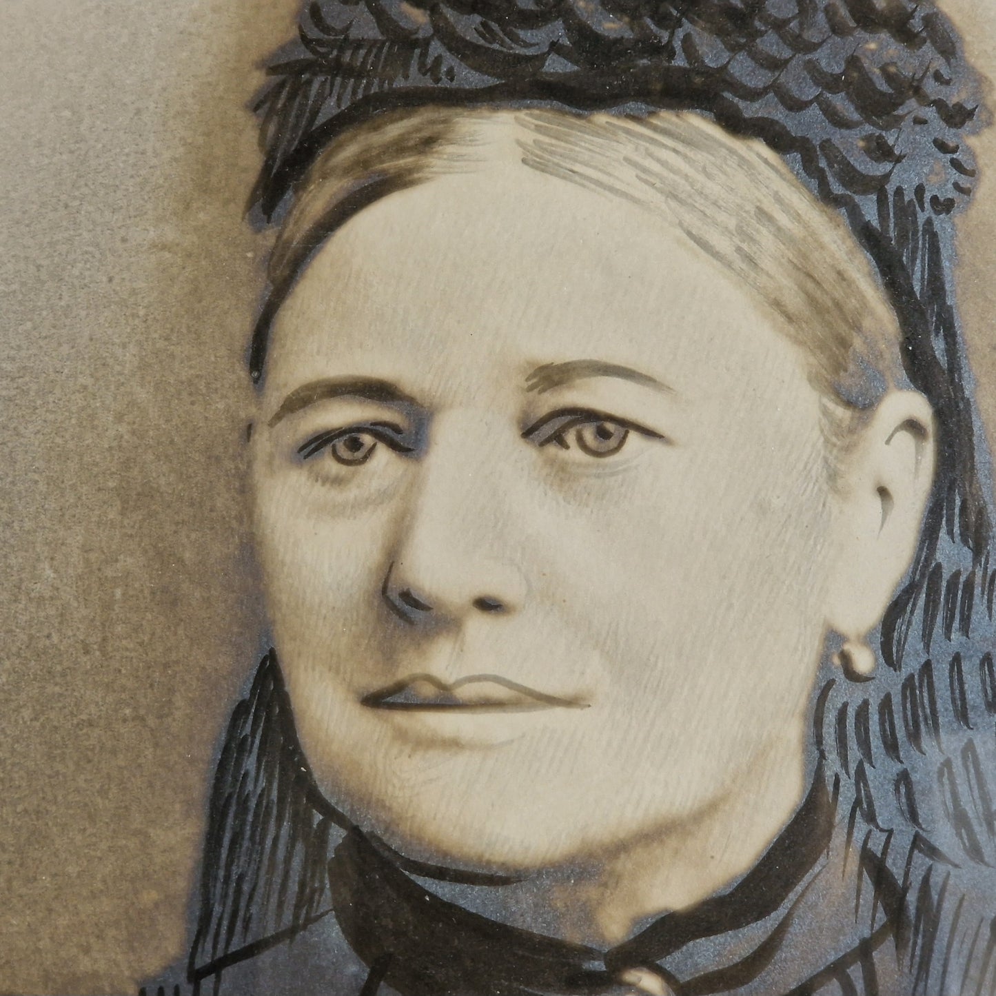 French antique overpainted photo portrait of a lady in a gilt gesso round frame.