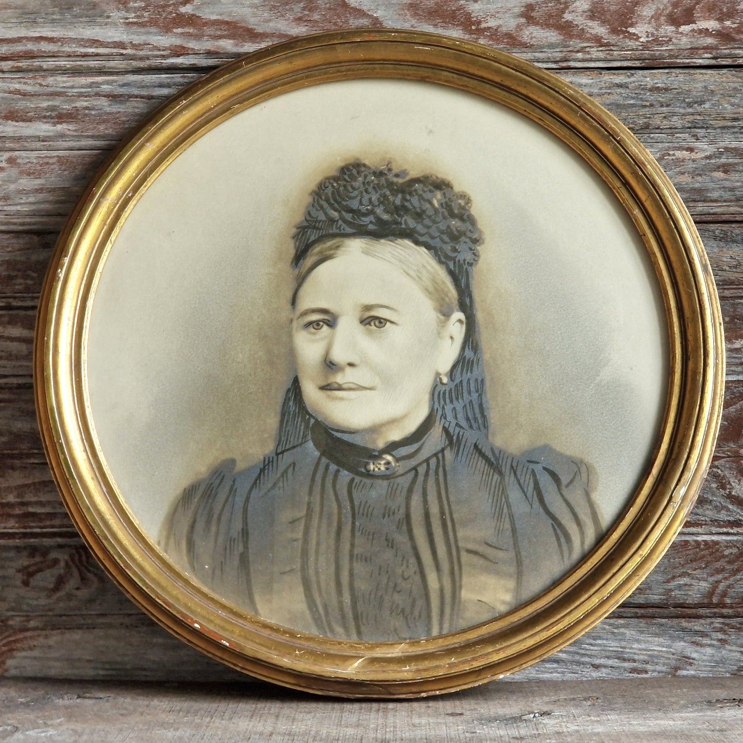 French antique overpainted photo portrait of a lady in a gilt gesso round frame.