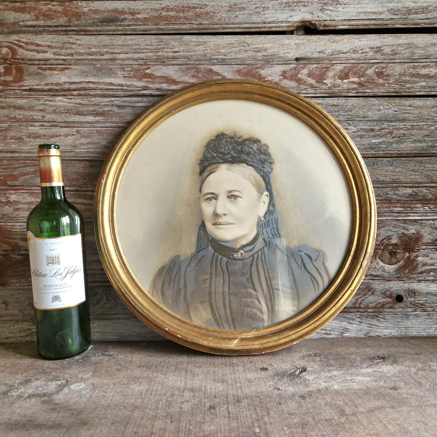 French antique overpainted photo portrait of a lady in a gilt gesso round frame.