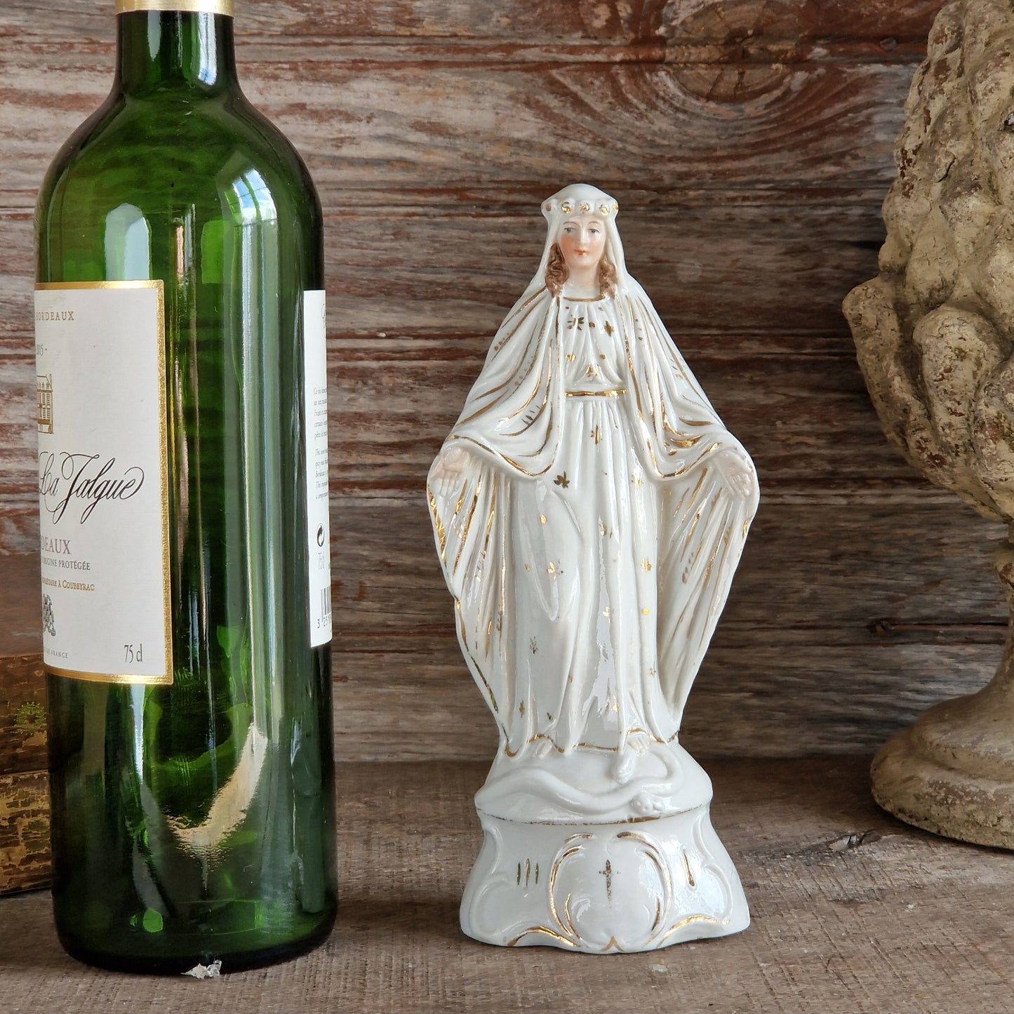 French porcelain Madonna statue with gilt decoration.