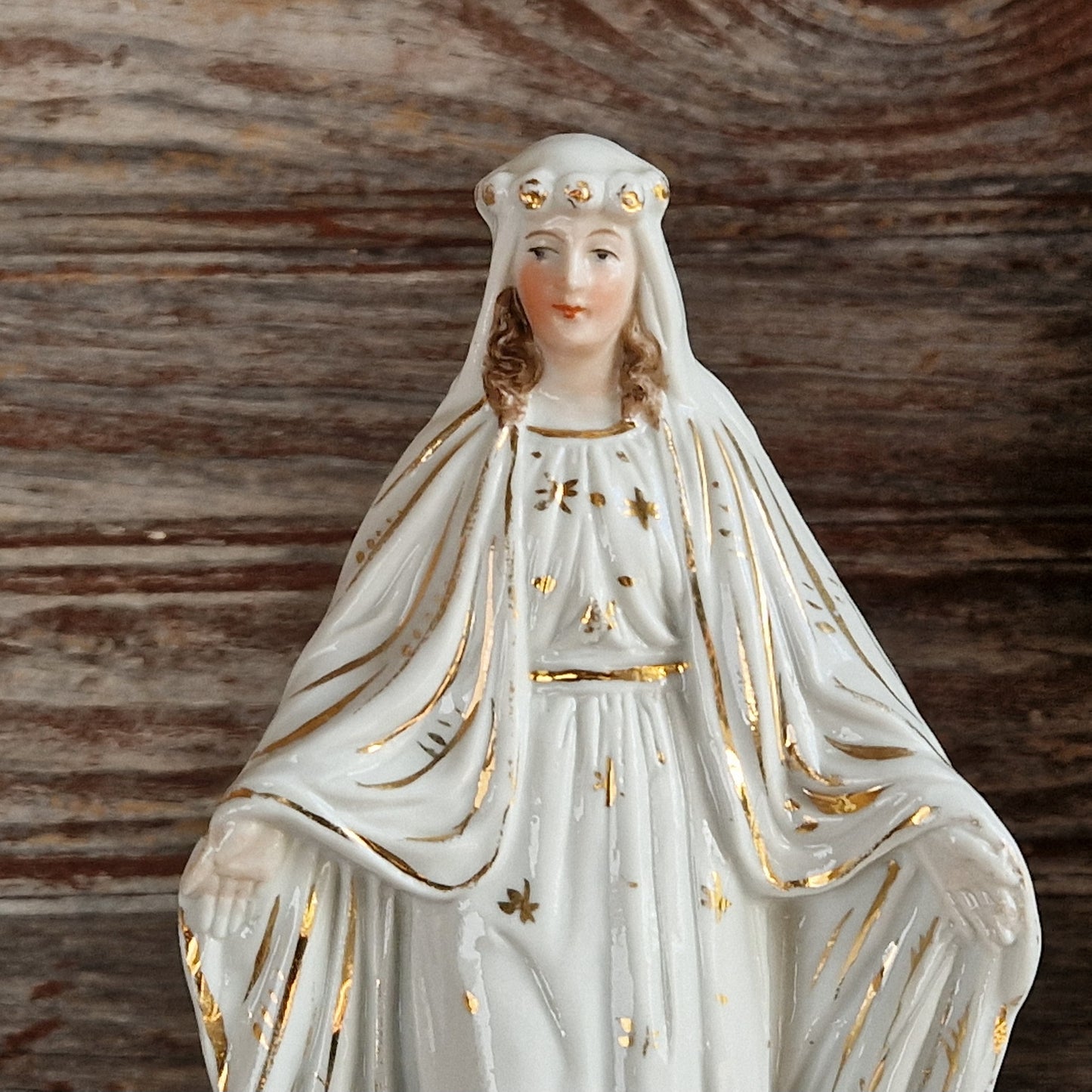 French porcelain Madonna statue with gilt decoration.