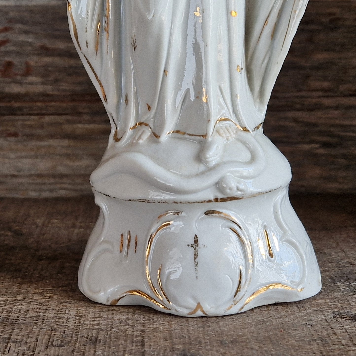 French porcelain Madonna statue with gilt decoration.