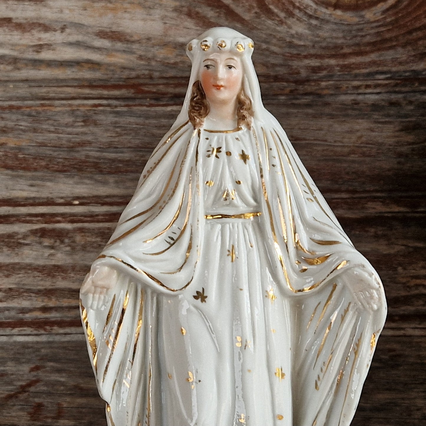 French porcelain Madonna statue with gilt decoration.