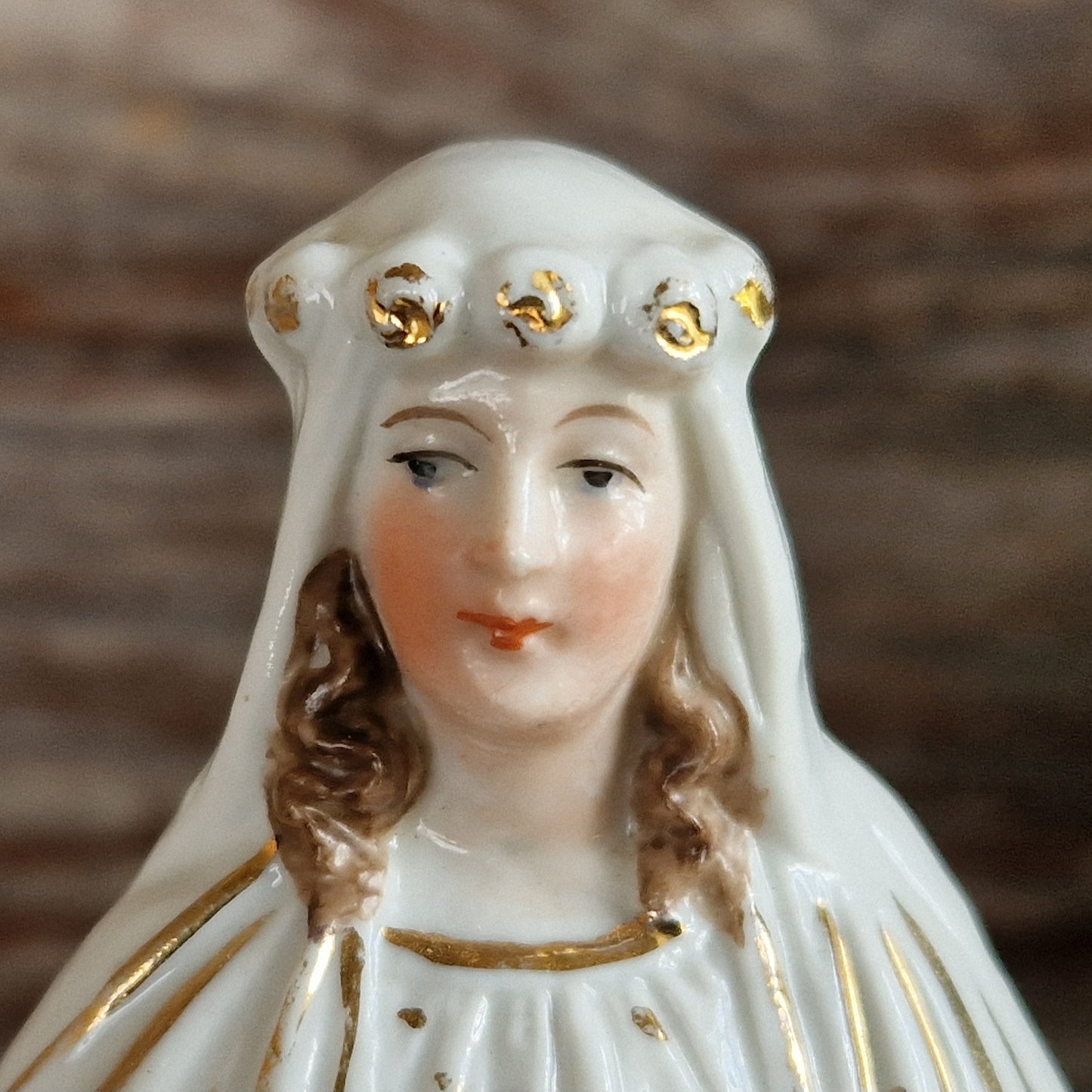 French porcelain Madonna statue with gilt decoration.