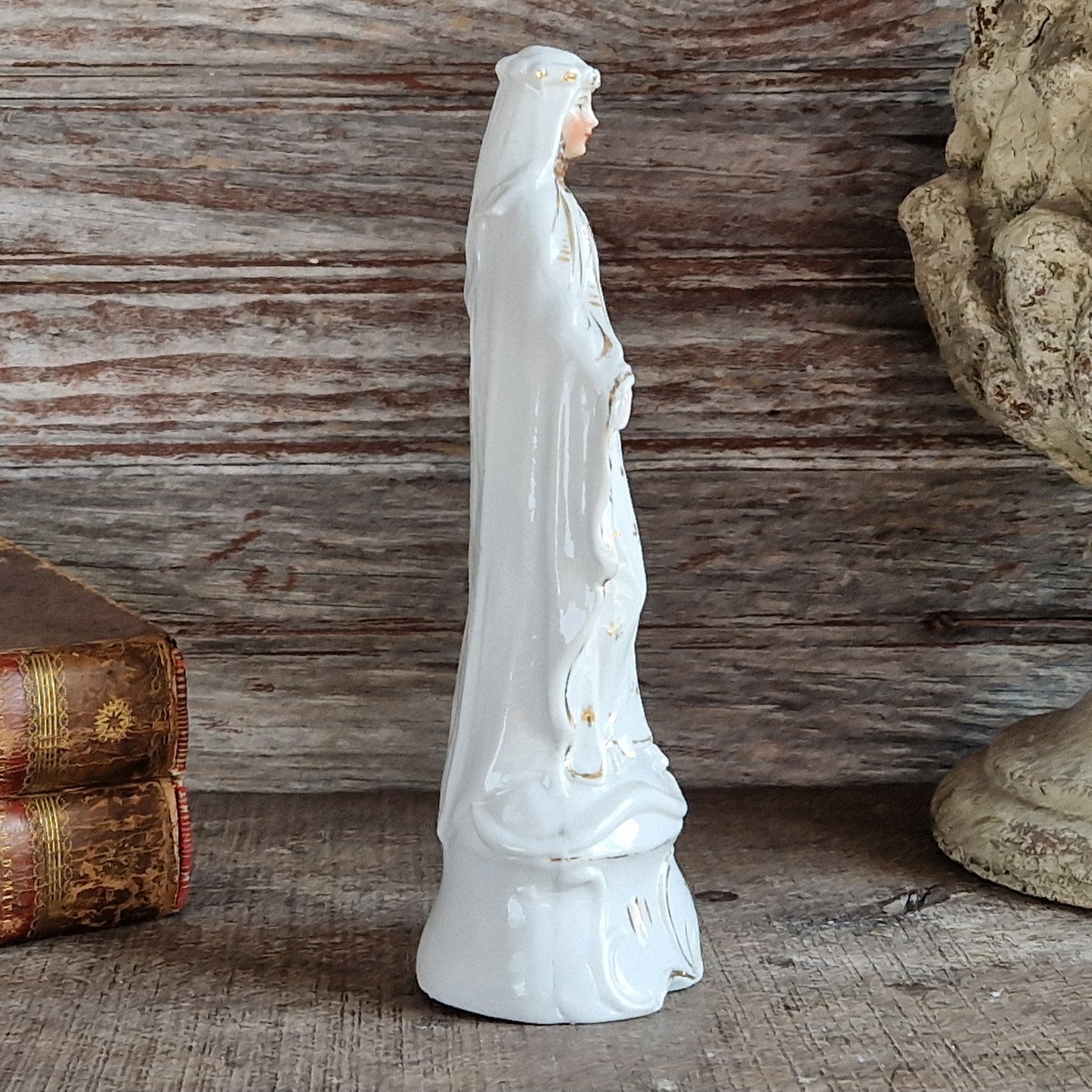 French porcelain Madonna statue with gilt decoration.