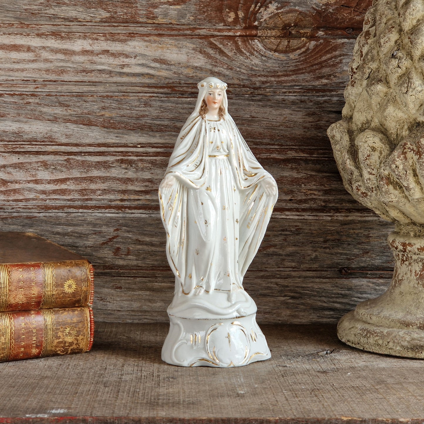 French porcelain Madonna statue with gilt decoration.