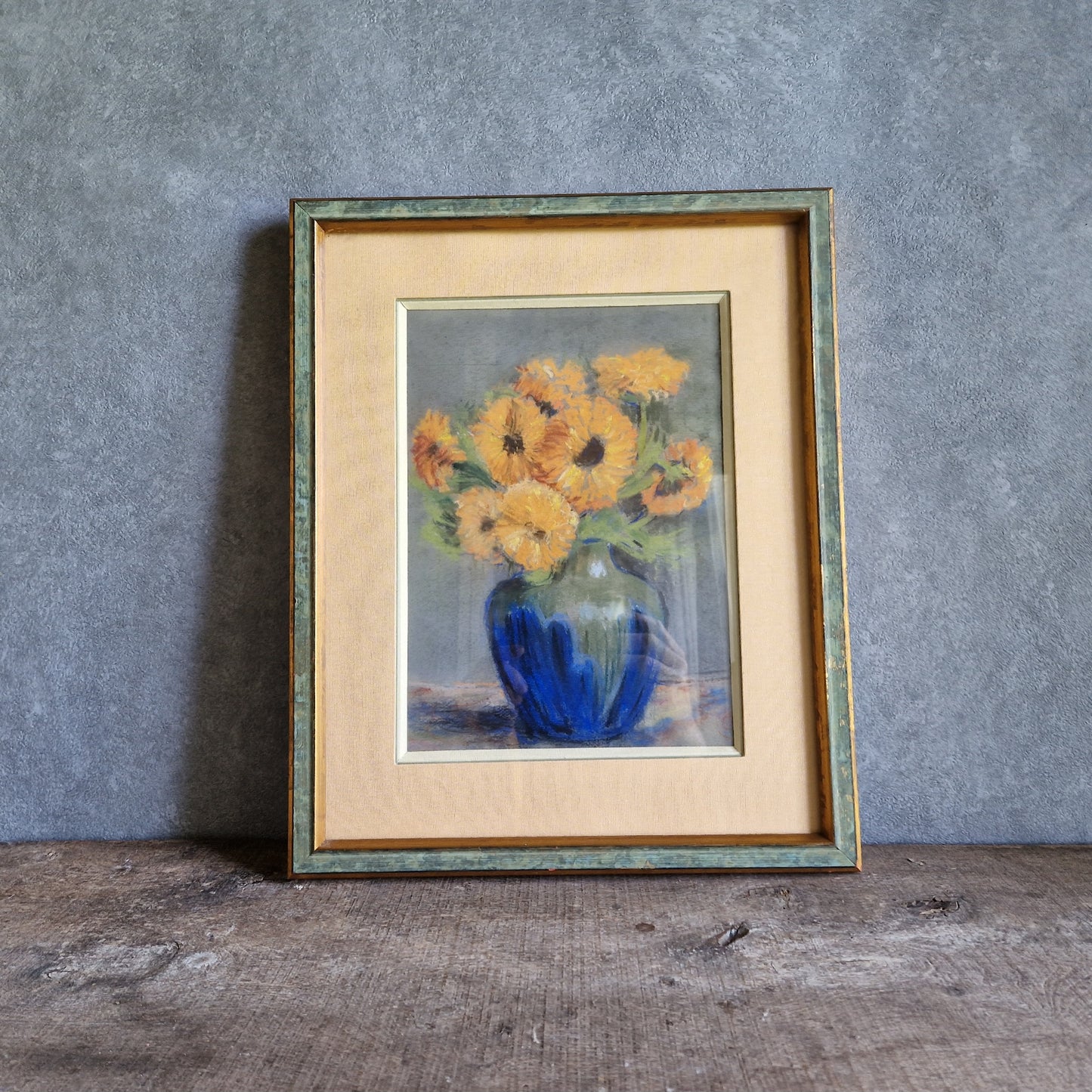 French pastel picture of sunflowers in a blue vase.