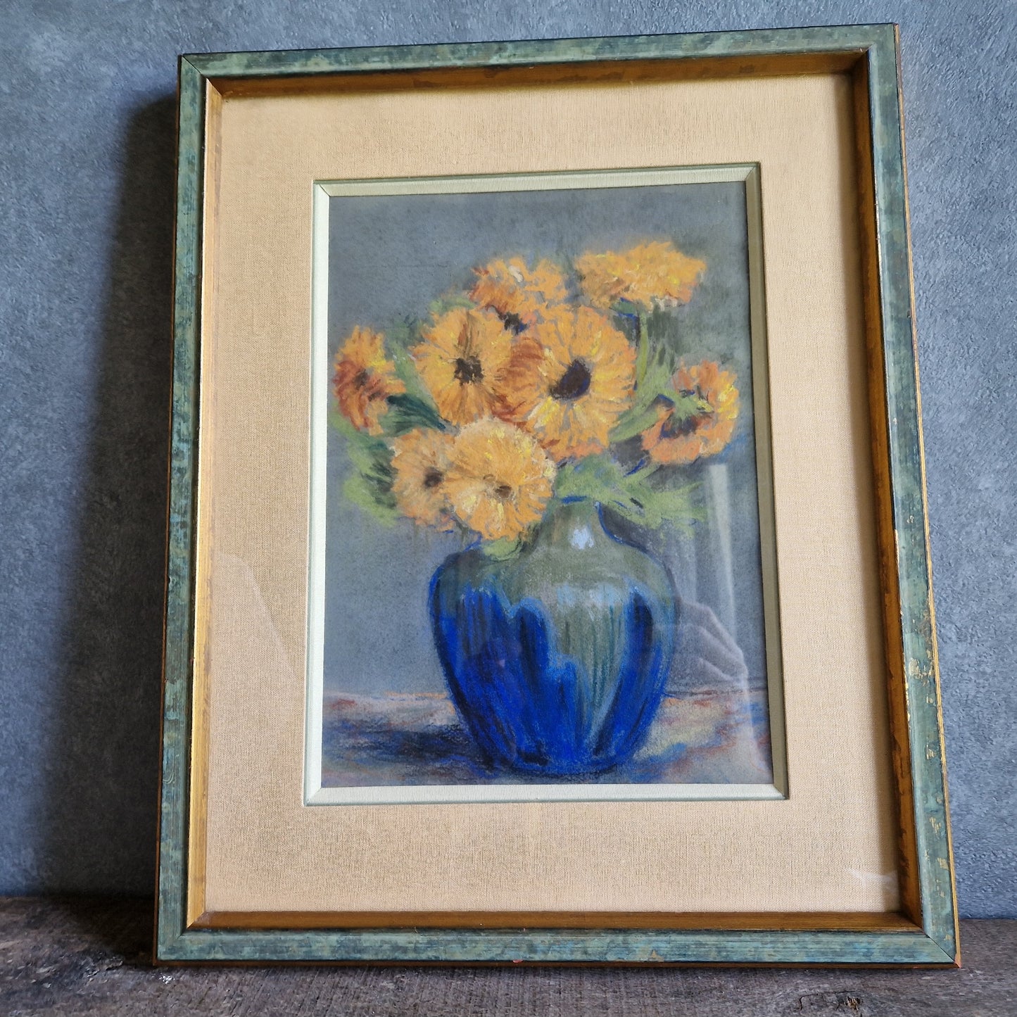 French pastel picture of sunflowers in a blue vase.