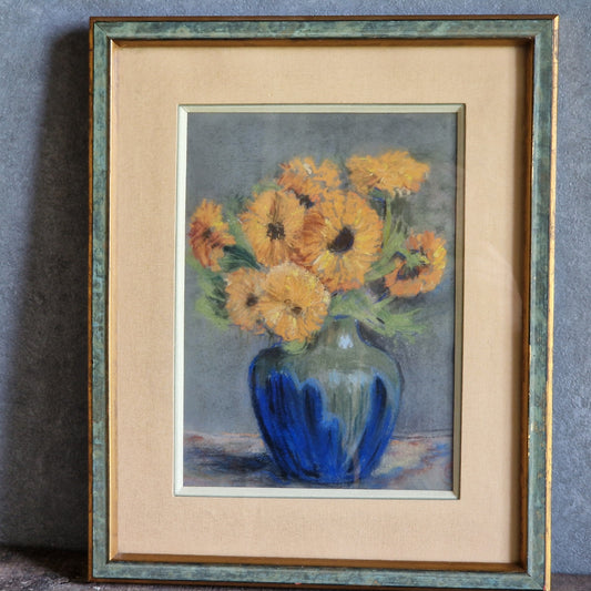 Framed artwork of a blue vase with yellow flowers on a gray background