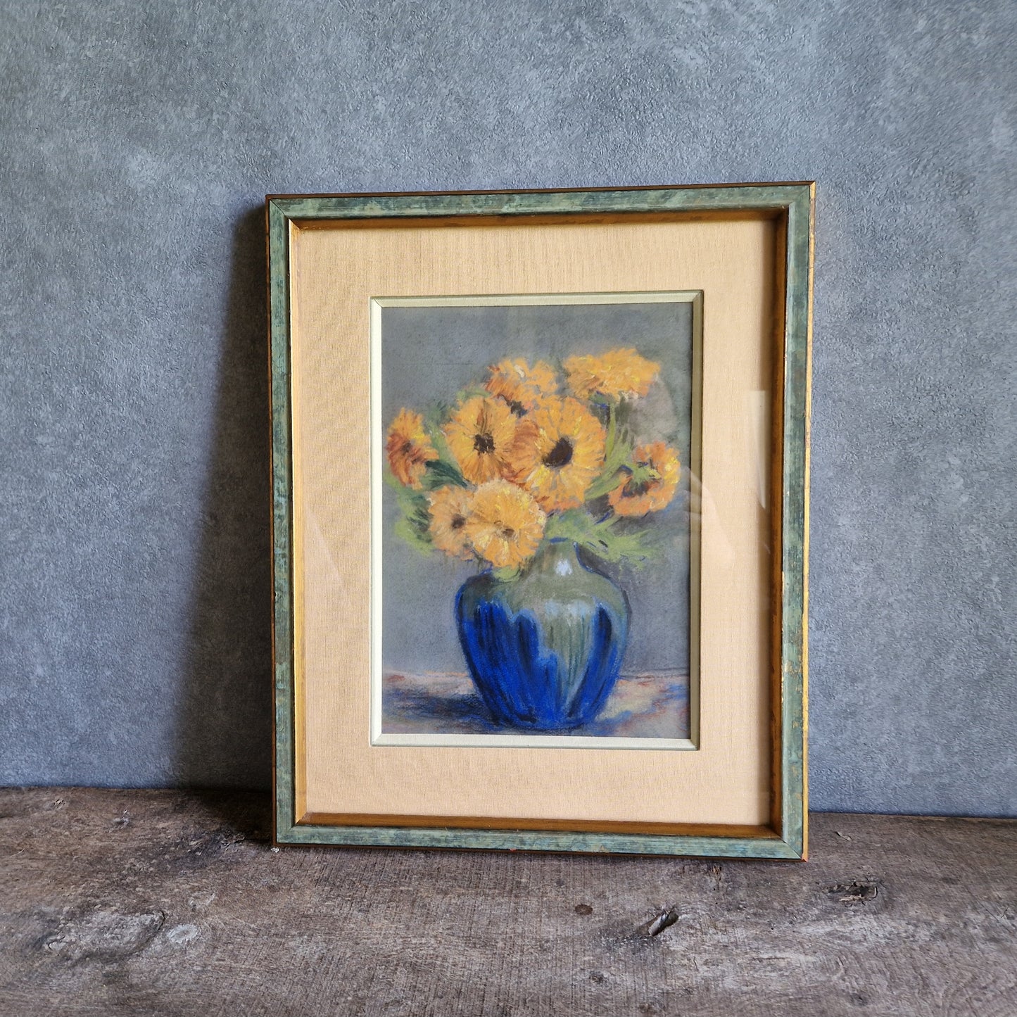 French pastel picture of sunflowers in a blue vase.