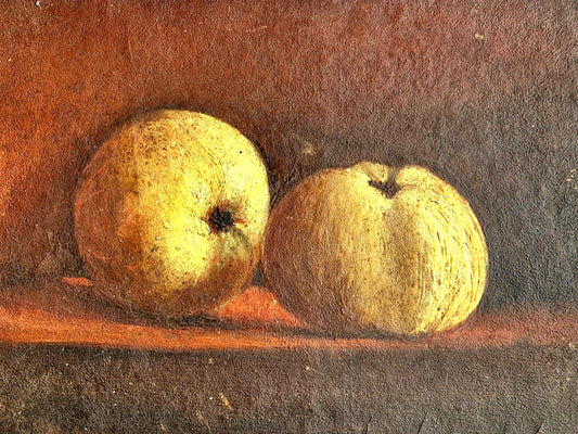 Two apples on a wooden surface with a dark background