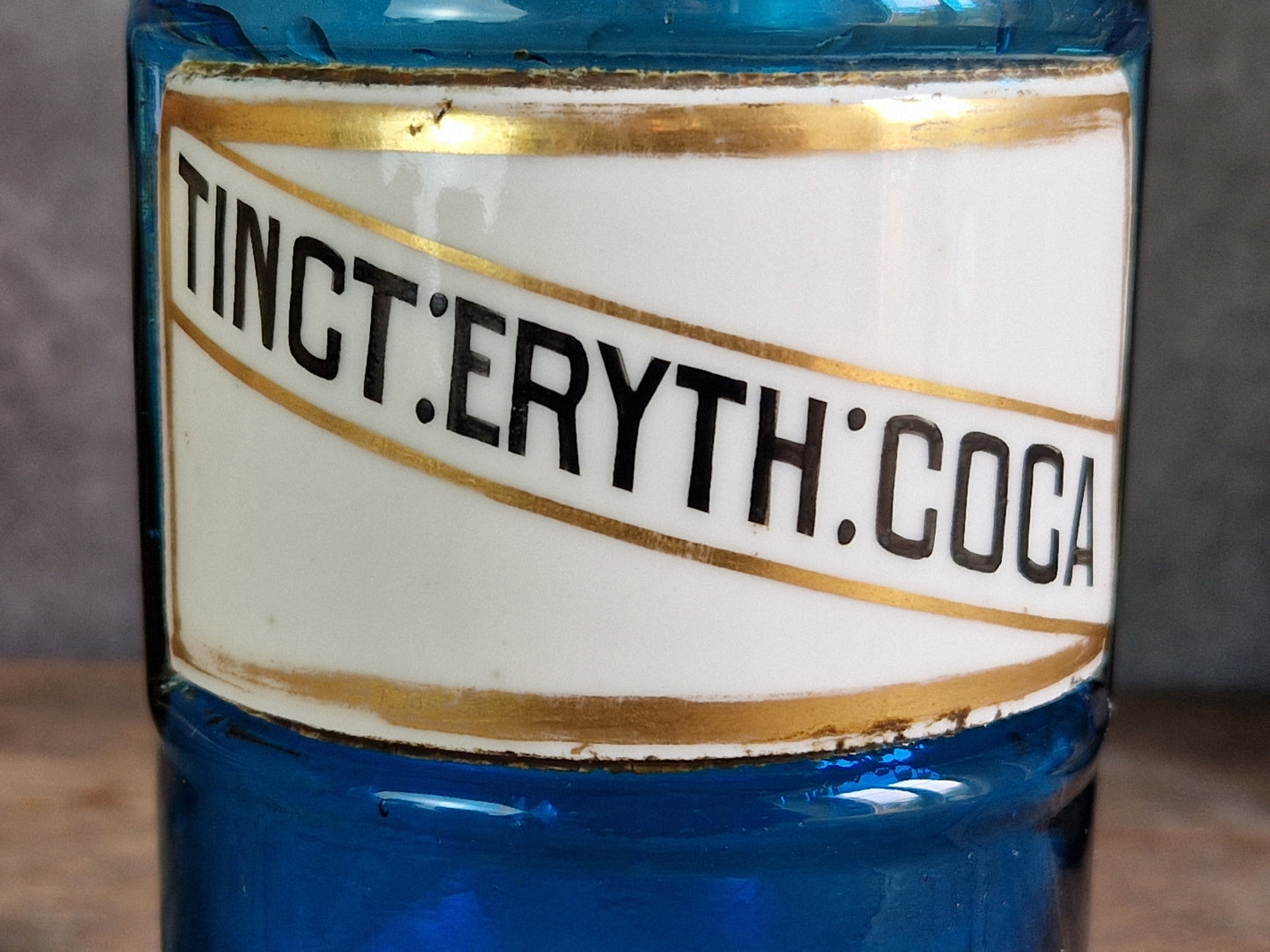 French blue antique apothecary bottle with toleware lid.
