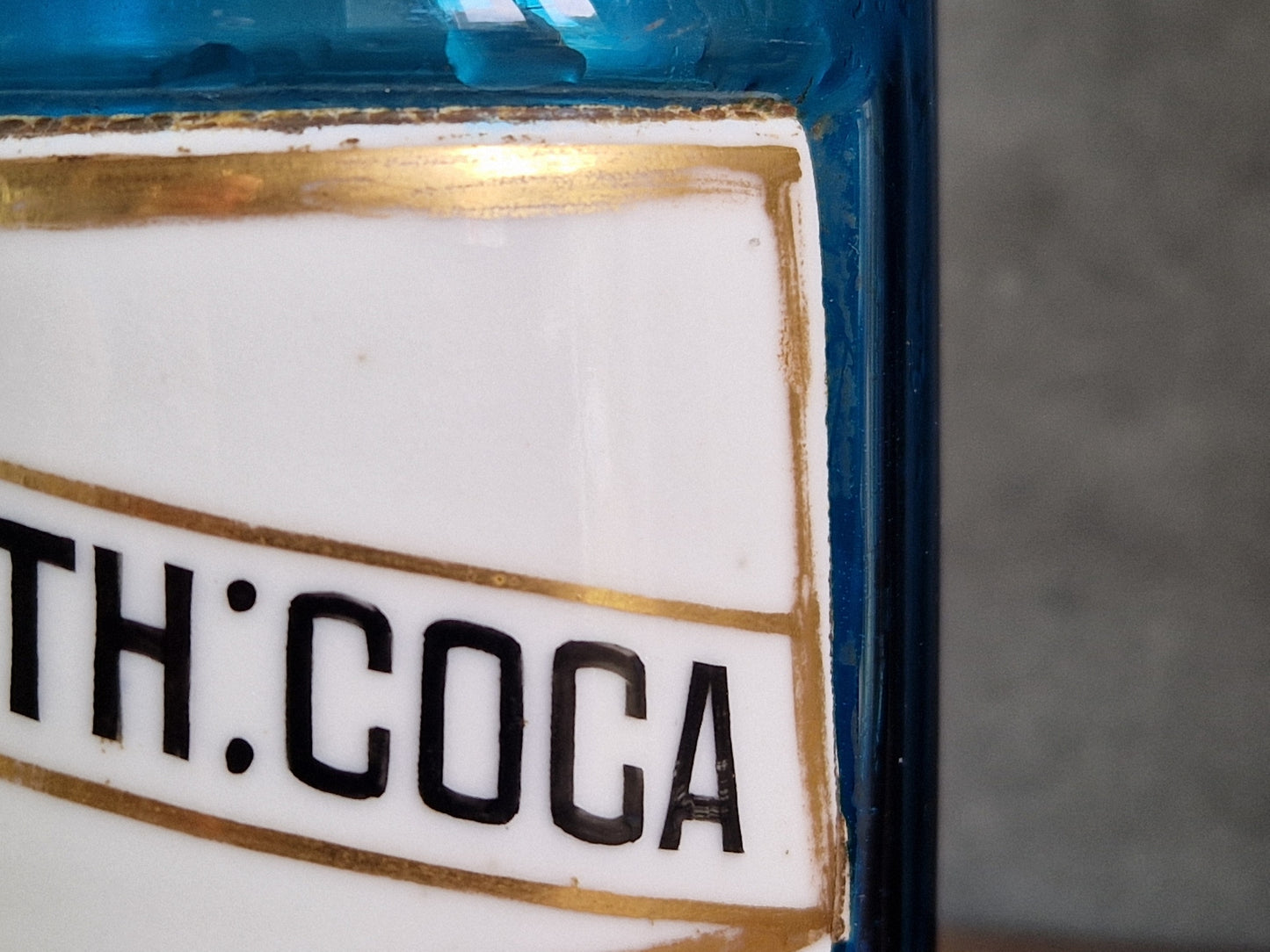 French blue antique apothecary bottle with toleware lid.