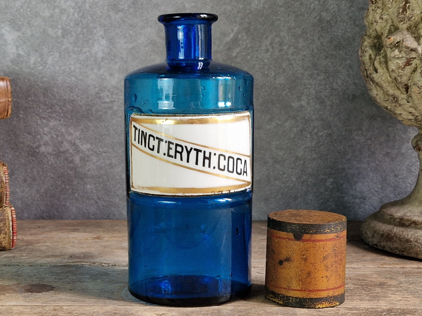 French blue antique apothecary bottle with toleware lid.