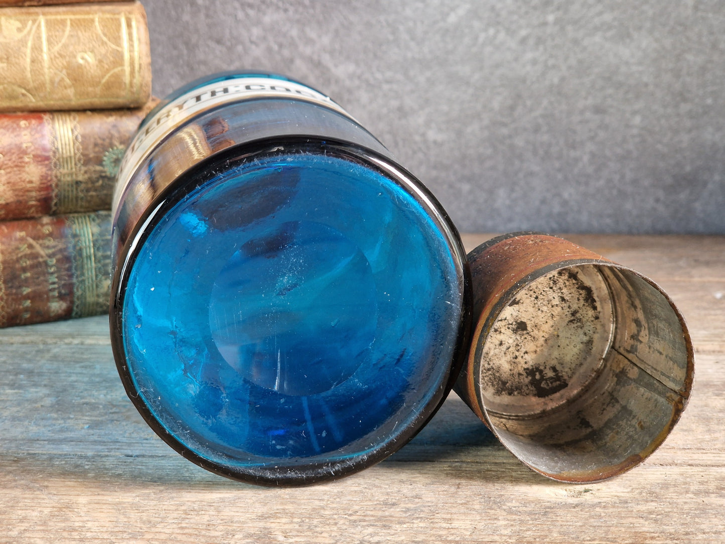 French blue antique apothecary bottle with toleware lid.
