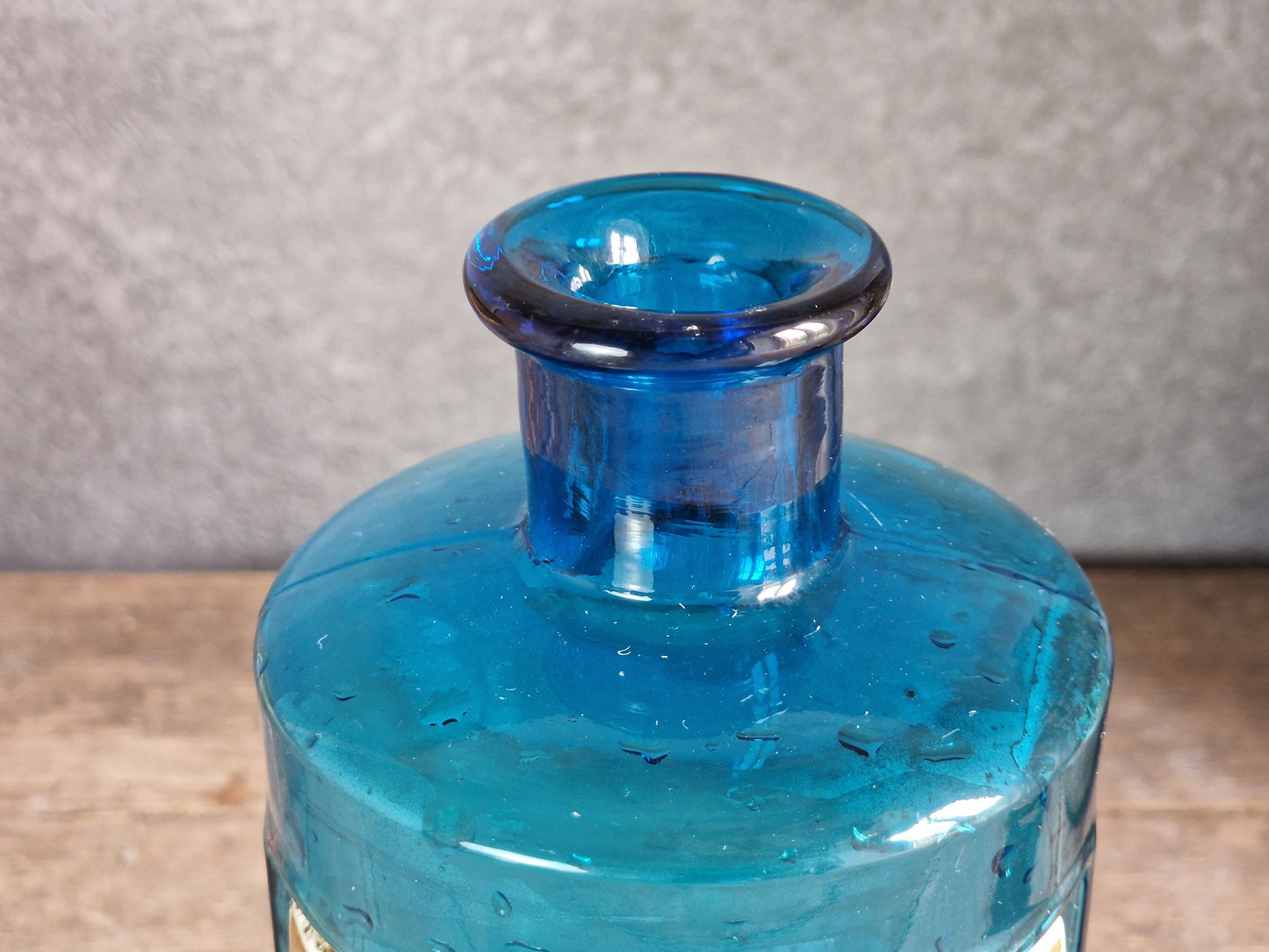 French blue antique apothecary bottle with toleware lid.