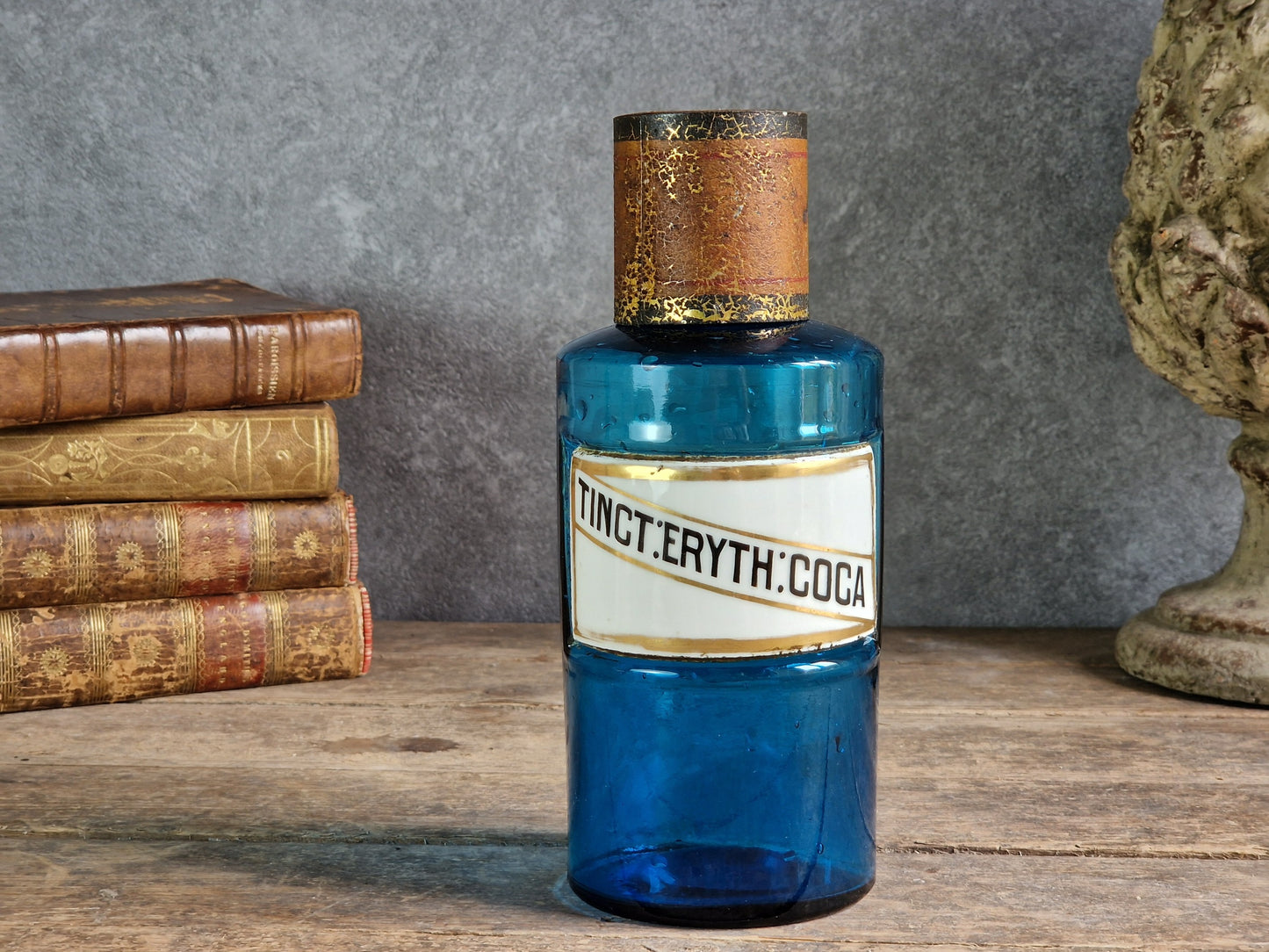 French blue antique apothecary bottle with toleware lid.