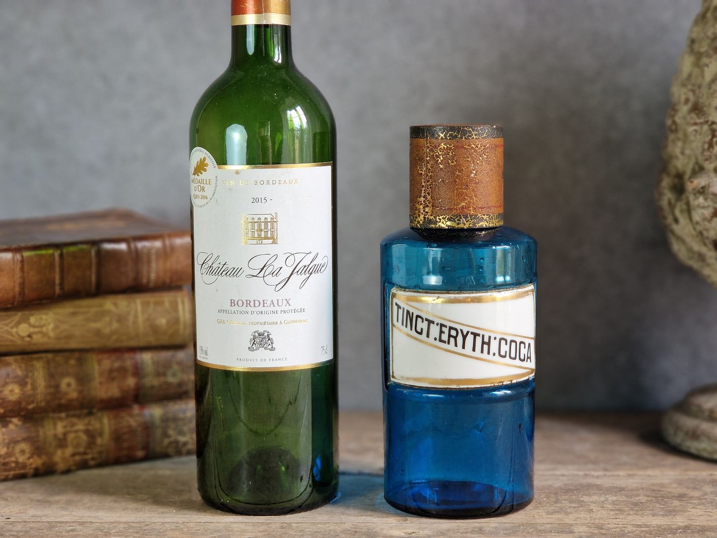 French blue antique apothecary bottle with toleware lid.