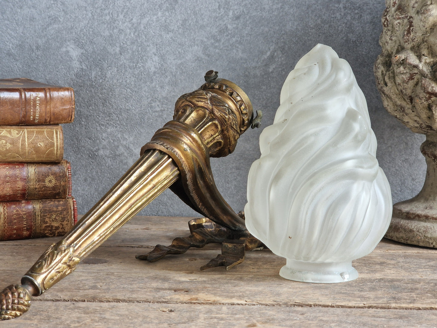 French antique gilt bronze wall sconce with torchere glass shade. Antique French wall light with 18th century decoration.