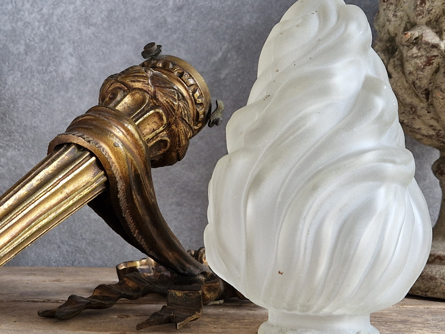 French antique gilt bronze wall sconce with torchere glass shade. Antique French wall light with 18th century decoration.