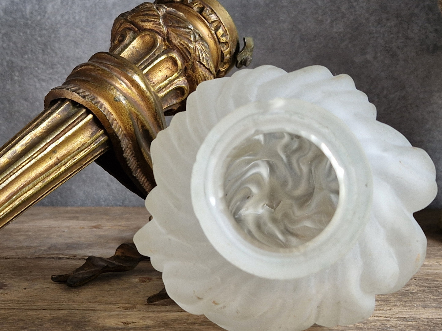 French antique gilt bronze wall sconce with torchere glass shade. Antique French wall light with 18th century decoration.