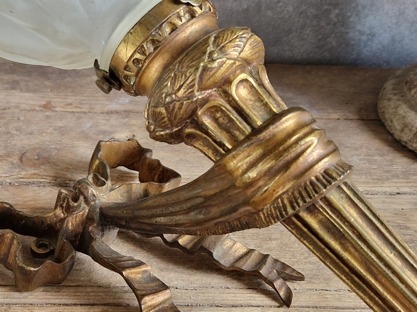 French antique gilt bronze wall sconce with torchere glass shade. Antique French wall light with 18th century decoration.