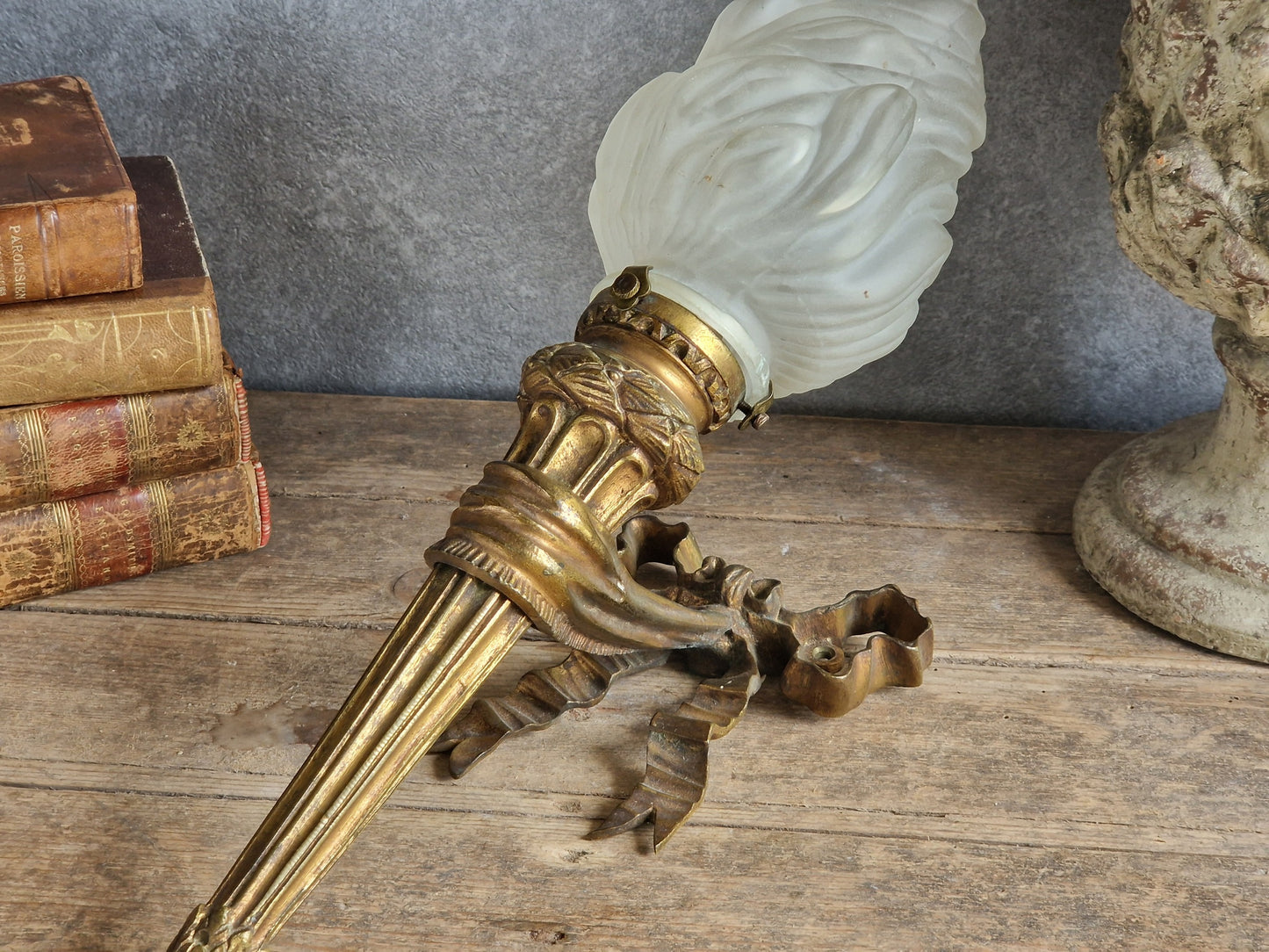 French antique gilt bronze wall sconce with torchere glass shade. Antique French wall light with 18th century decoration.