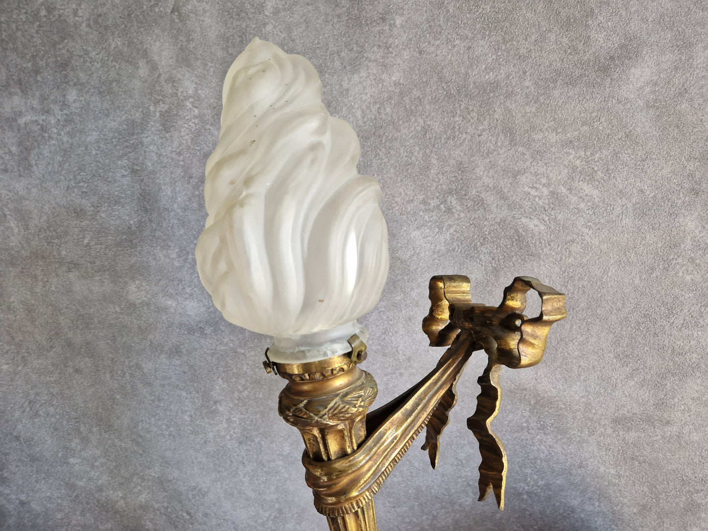 French antique gilt bronze wall sconce with torchere glass shade. Antique French wall light with 18th century decoration.