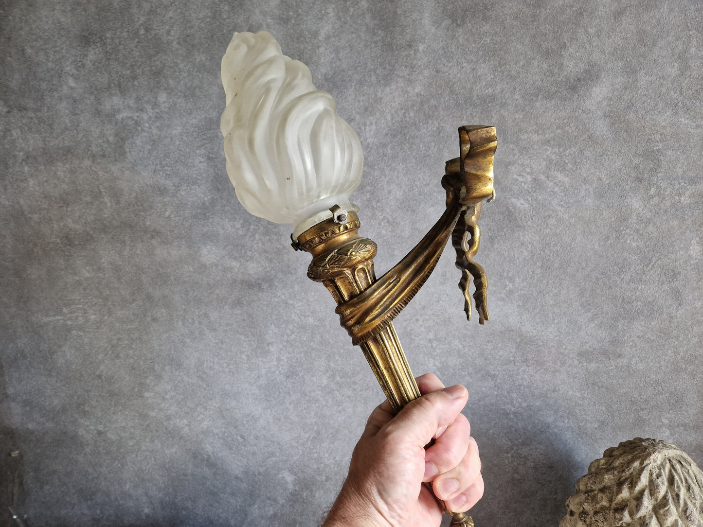 French antique gilt bronze wall sconce with torchere glass shade. Antique French wall light with 18th century decoration.