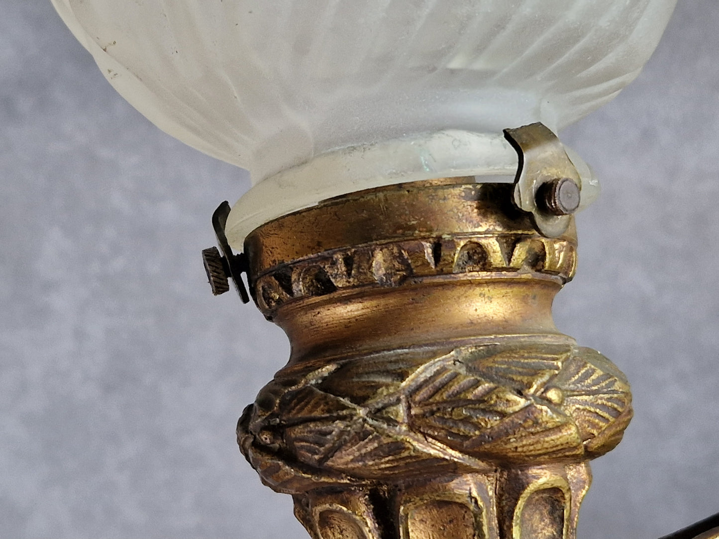 French antique gilt bronze wall sconce with torchere glass shade. Antique French wall light with 18th century decoration.