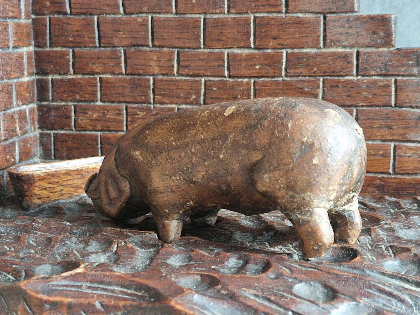 French wooden folk art pig diorama. Hand carved wooden pig in sty.