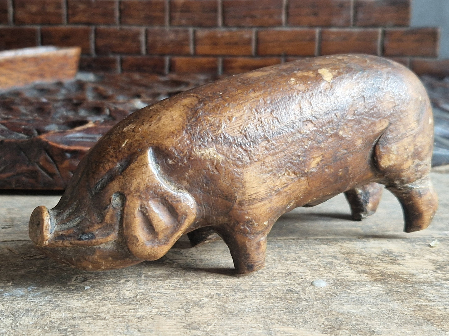 French wooden folk art pig diorama. Hand carved wooden pig in sty.