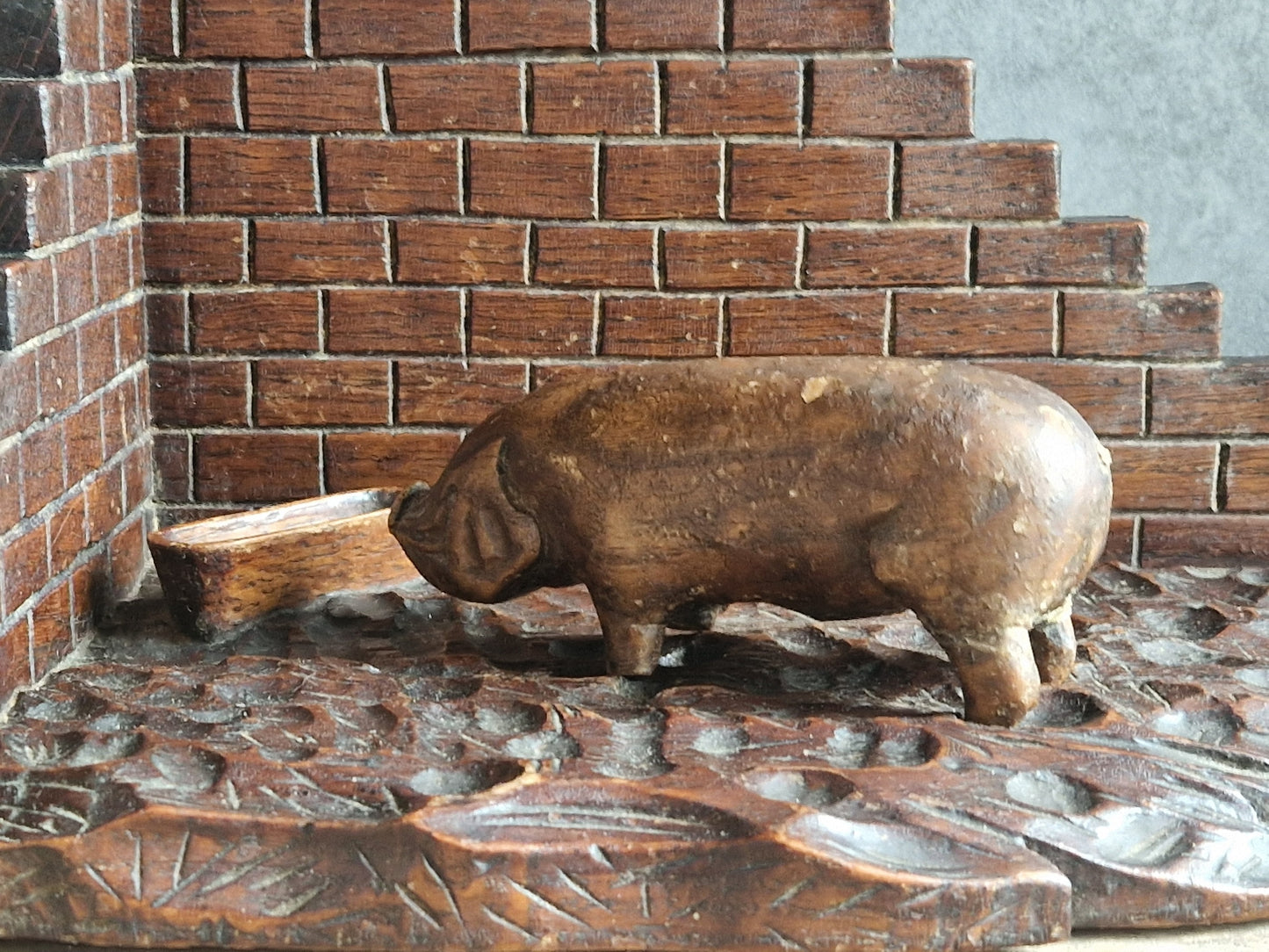 French wooden folk art pig diorama. Hand carved wooden pig in sty.